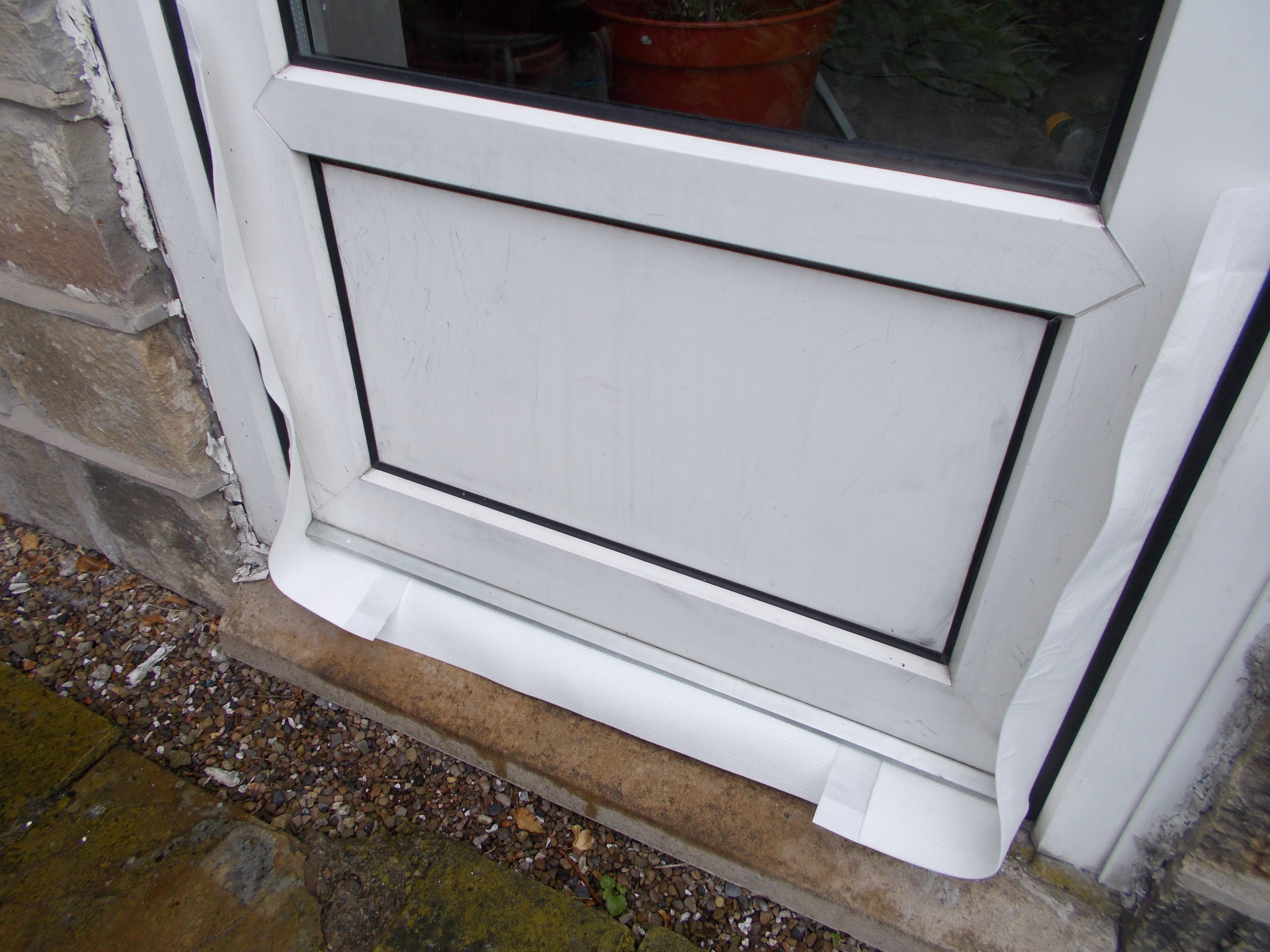 Flood Traps fitted dry around an outside door in preparation for a flood